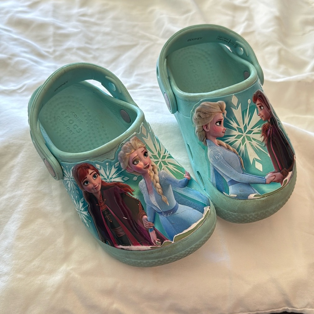 Crocs. Disney Frozen II size 9. Nice shape. Elsa & Anna on front.